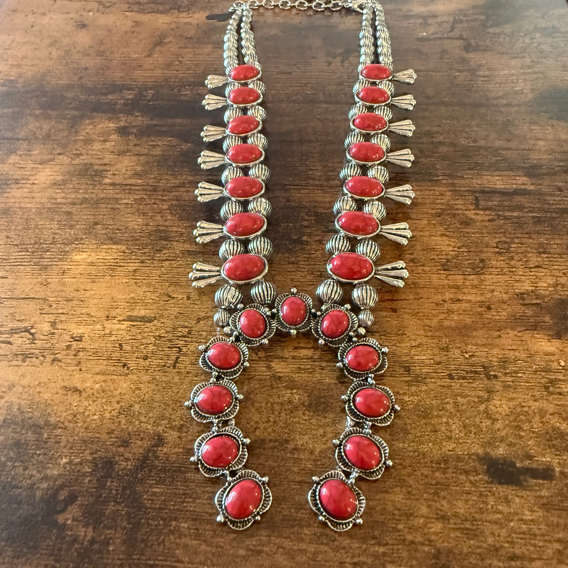 Red stone squash blossom Western necklace with faux silver pearl beads and intricate silver detailing.