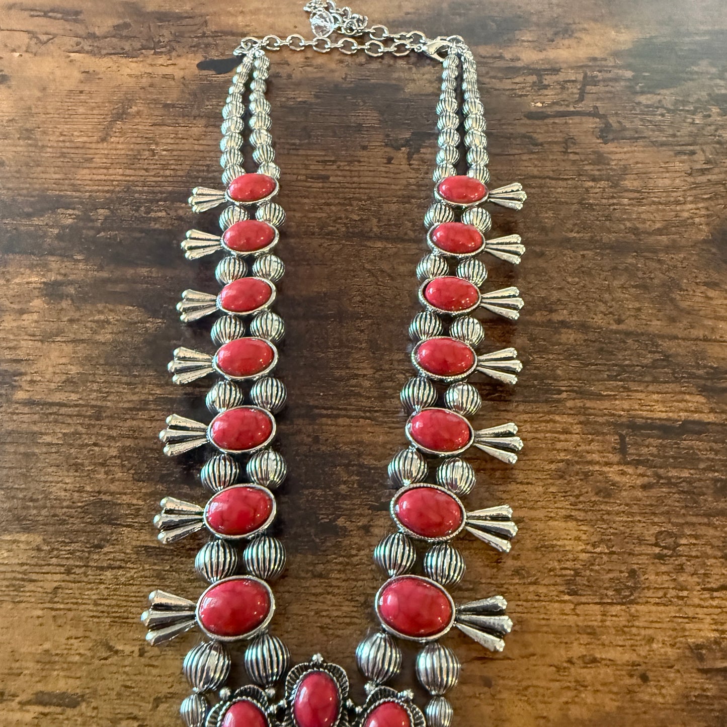 Red Stone Squash Blossom Western Necklace with faux silver pearl beads and intricate silver detailing.